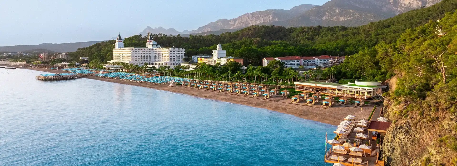 <div style="padding-left: 70px;"><img style="width: 100px; height: auto; margin: 25px 0;" src="https://b2ccdn.coraltravel.lv/content/Main Page Hotels Banners Destinations_Turkyie LV.svg" loading="lazy"></div>
<div style="padding-left: 70px; margin-bottom: 20px;"><img style="width: 200px; height: auto;" src="https://b2ccdn.coraltravel.lt/content/logos/hotel-logos/nirvana-logo-200.webp" loading="lazy"></div>
<div style="font-size: 28px; font-weight: 600; padding-left: 70px;">Nirvana Hotels</div>