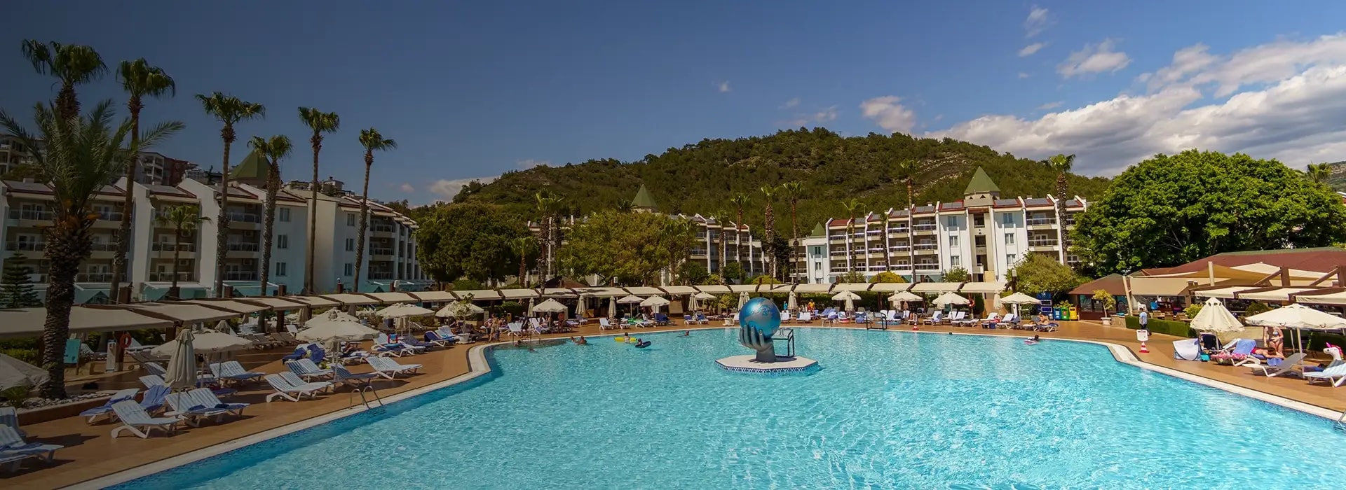 <div style="padding-left: 70px;"><img style="width: 100px; height: auto; margin: 25px 0;" src="https://b2ccdn.coraltravel.lv/content/Main Page Hotels Banners Destinations_Turkyie LV.svg" loading="lazy"></div>
<div style="padding-left: 70px; margin-bottom: 20px;"><img style="width: 200px; height: auto;" src="https://b2ccdn.coraltravel.lt/content/logos/hotel-logos/marvida pacha w200px.webp" loading="lazy"></div>
<div style="font-size: 28px; font-weight: 600; padding-left: 70px;">MARVIDA CLUB PALMERAS PASCHA</div>