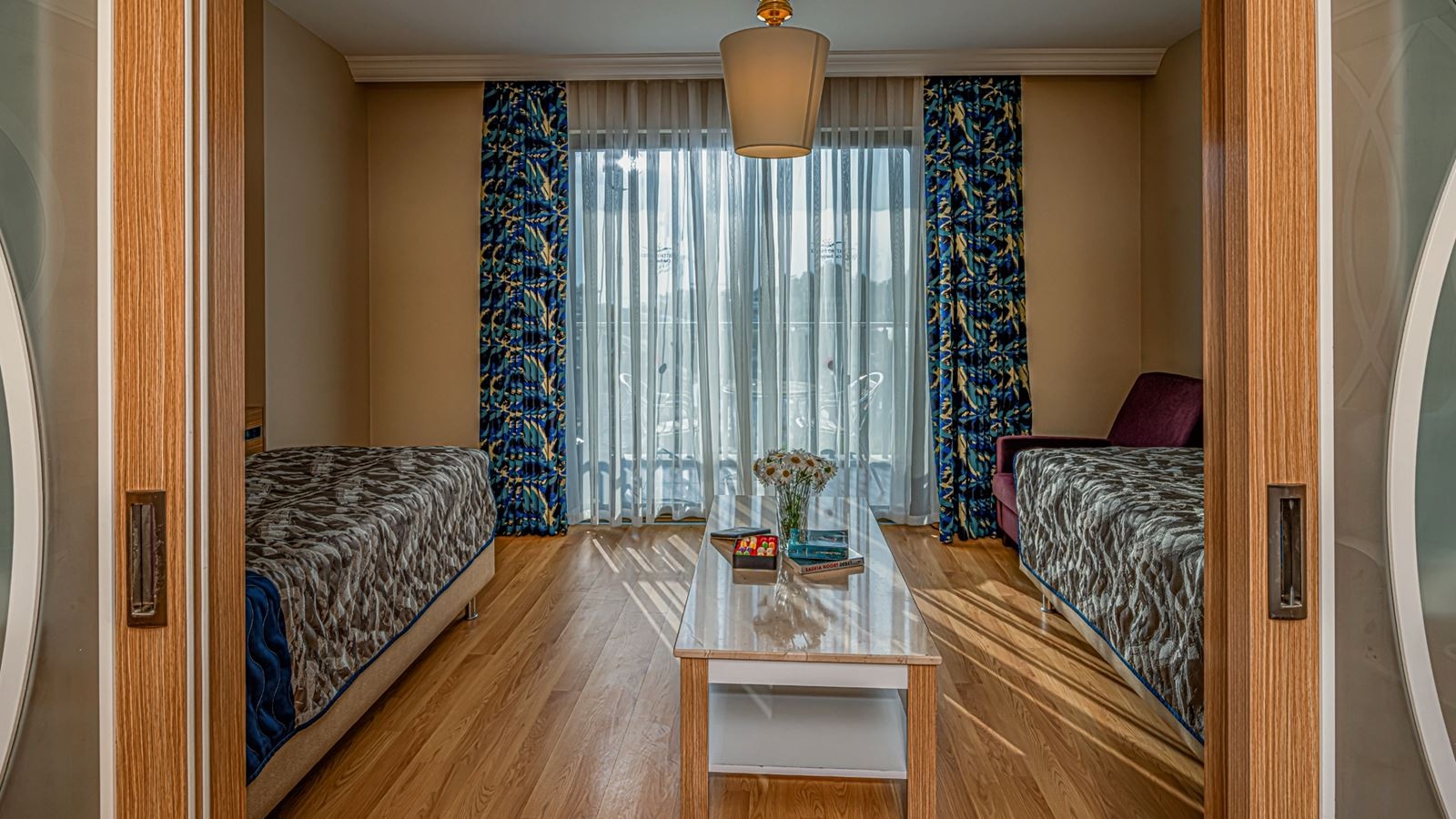 rooms-main-building-family-2-bedrooms-with-sliding-doors-pool-view-couple--ladies-only